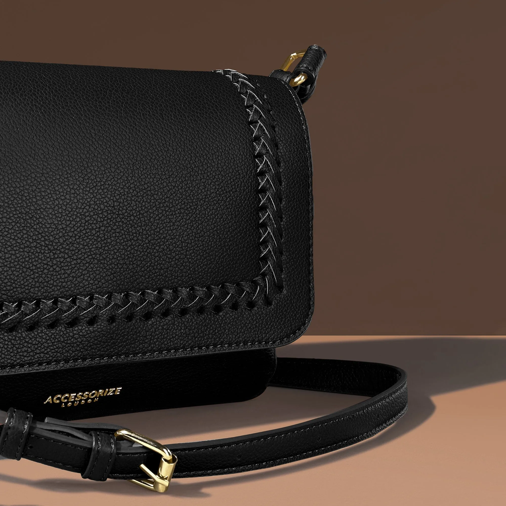 Accessorize London Women's Black Caffy Camera Braided Faux Leather Sling Bag